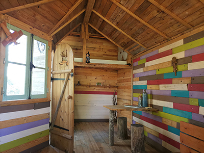 The colorful interior of the cabin next to the pond